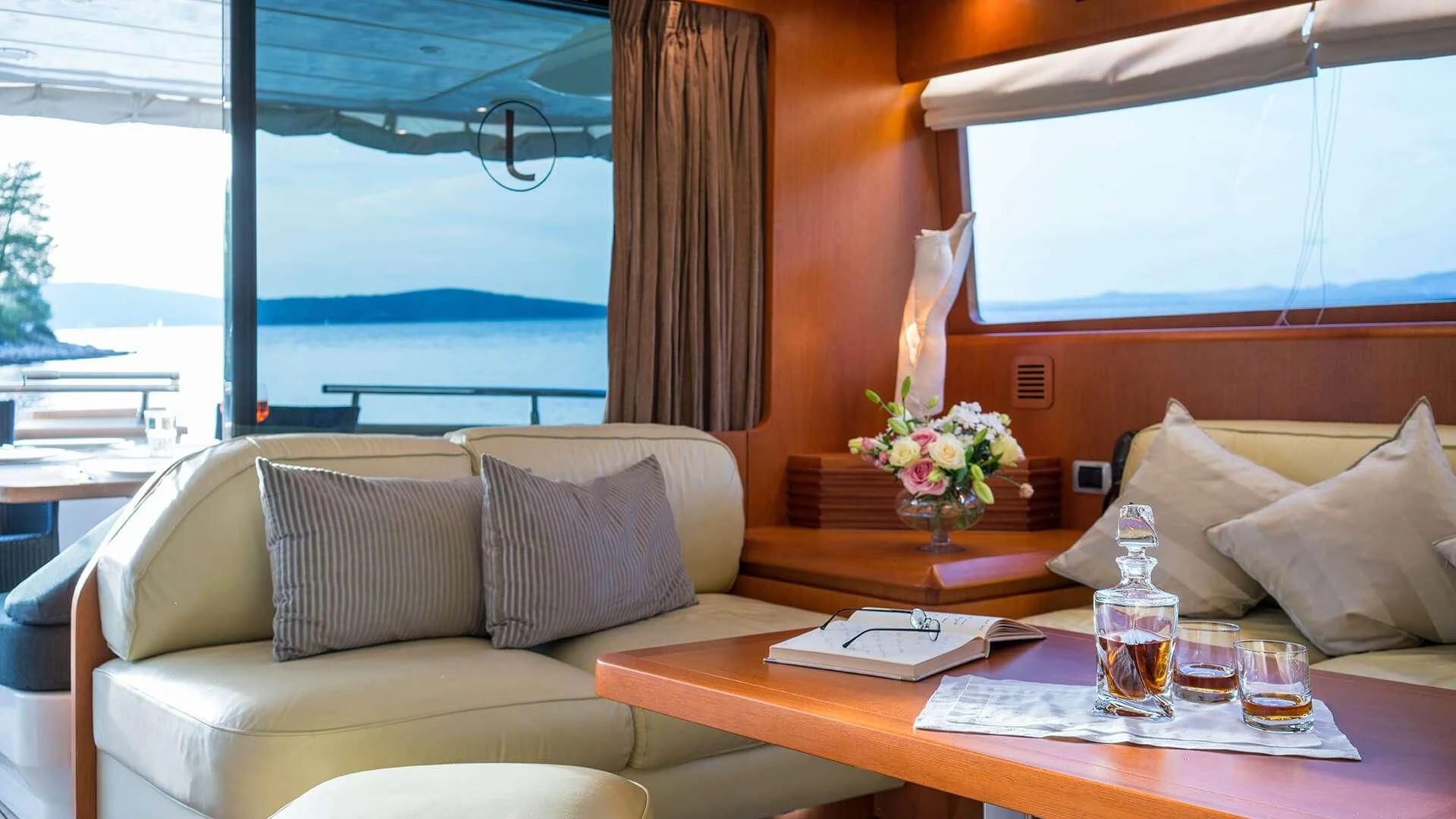 a living room with a table and couches aboard JANTAR Yacht for Charter