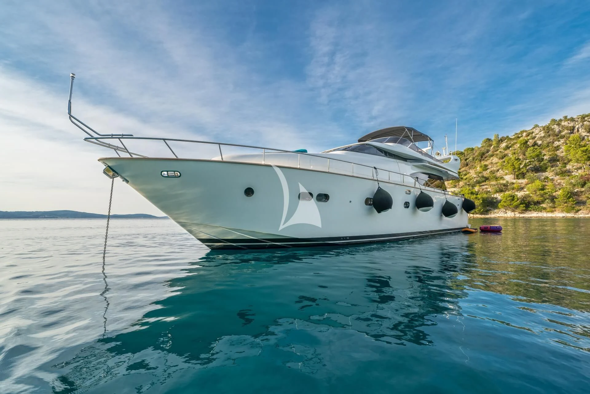 a white boat in the water aboard JANTAR Yacht for Charter