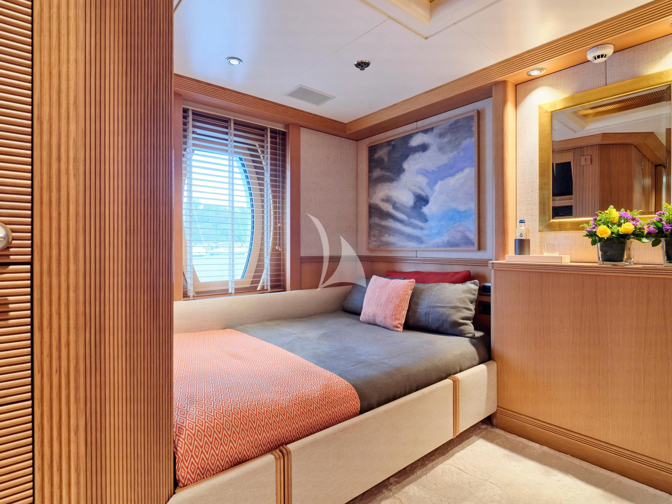 a room with a bed and a mirror aboard SEAHORSE Yacht for Sale