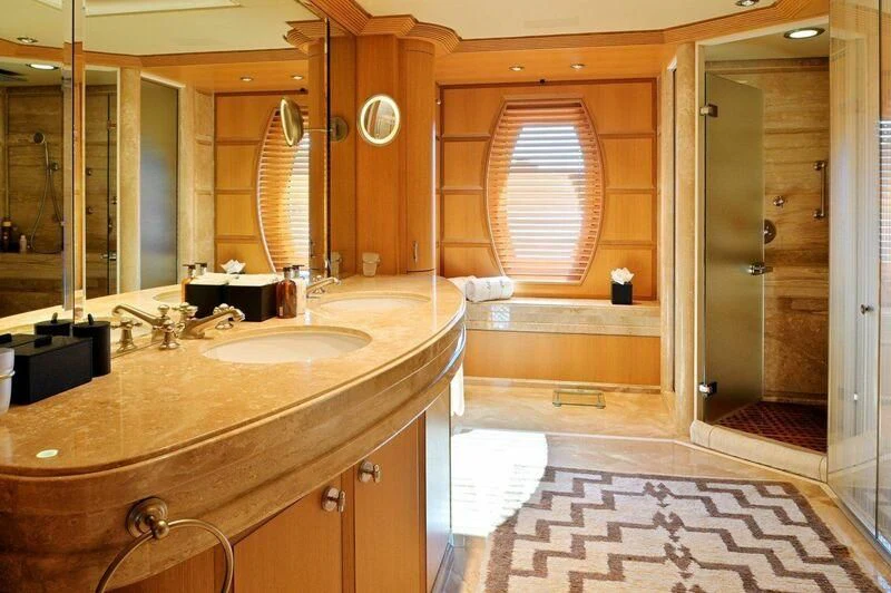 a bathroom with a countertop sink and a mirror aboard SEAHORSE Yacht for Sale