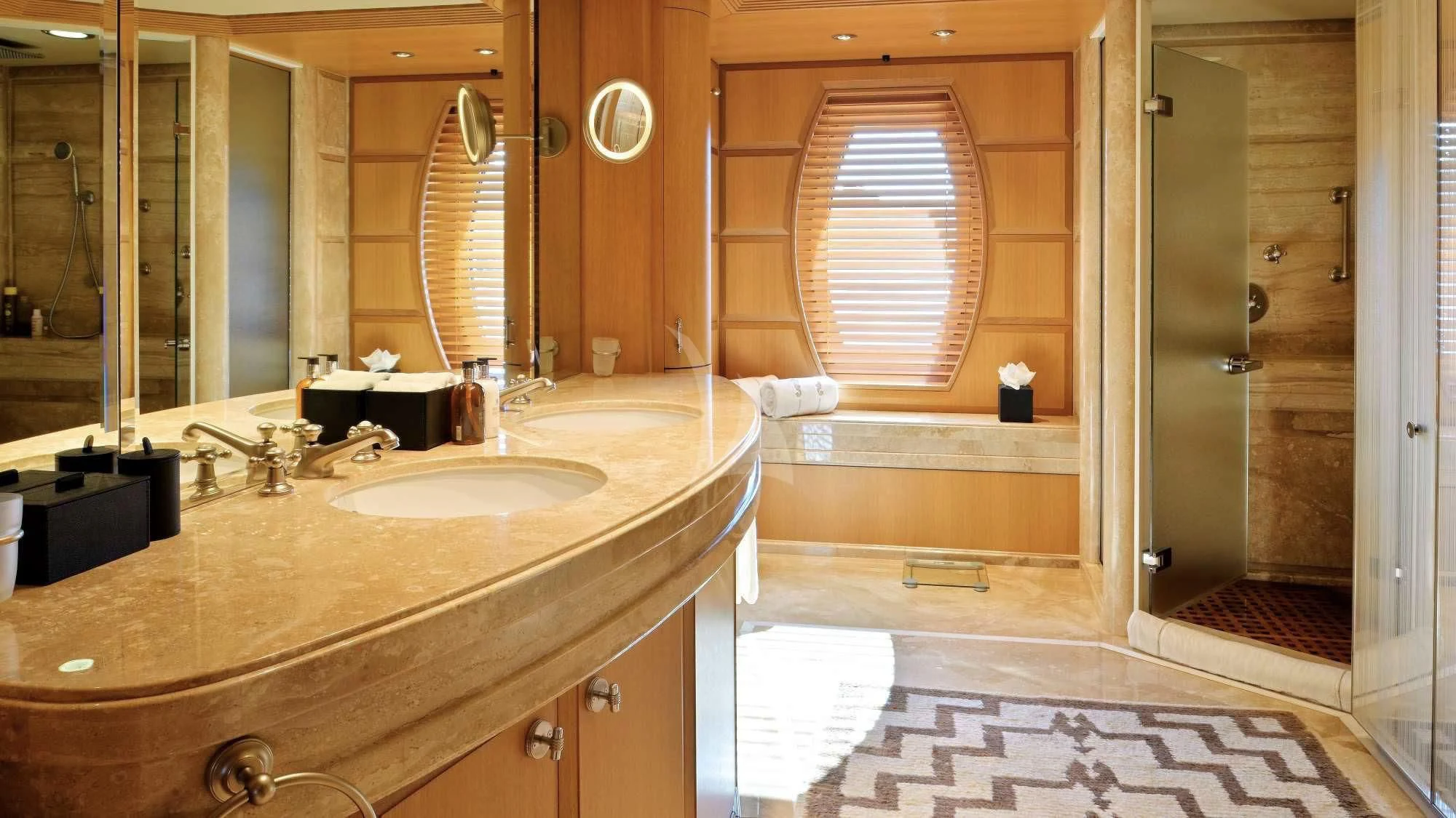 a bathroom with a sink and a large mirror aboard SEAHORSE Yacht for Sale
