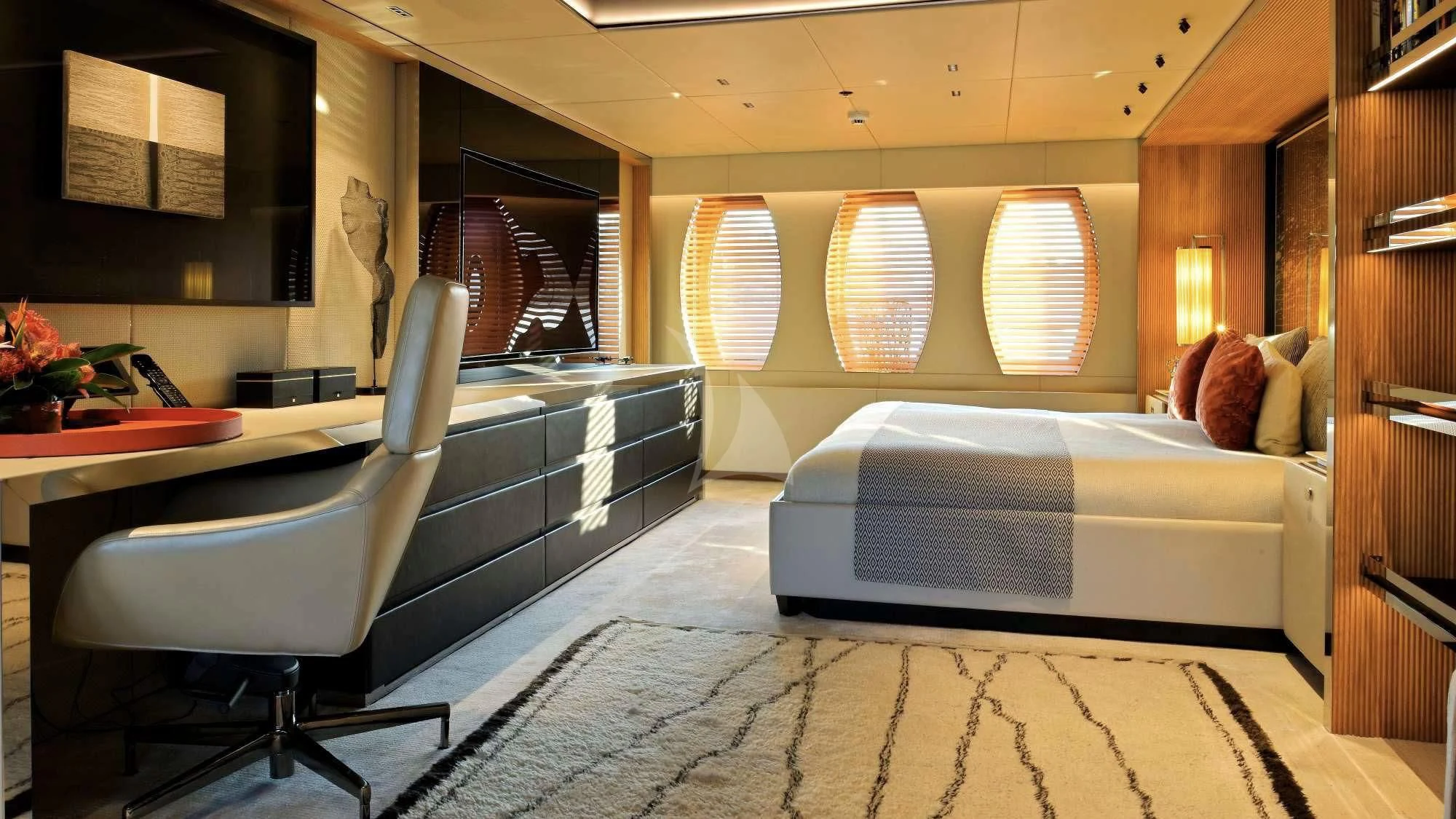 a room with a bed and a desk aboard SEAHORSE Yacht for Sale