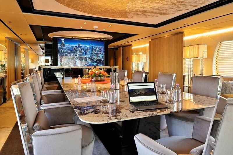 a conference room with a table and chairs aboard SEAHORSE Yacht for Sale