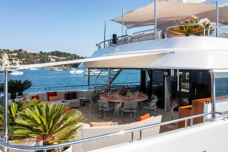 a large white building with a balcony overlooking a body of water aboard SEAHORSE Yacht for Sale