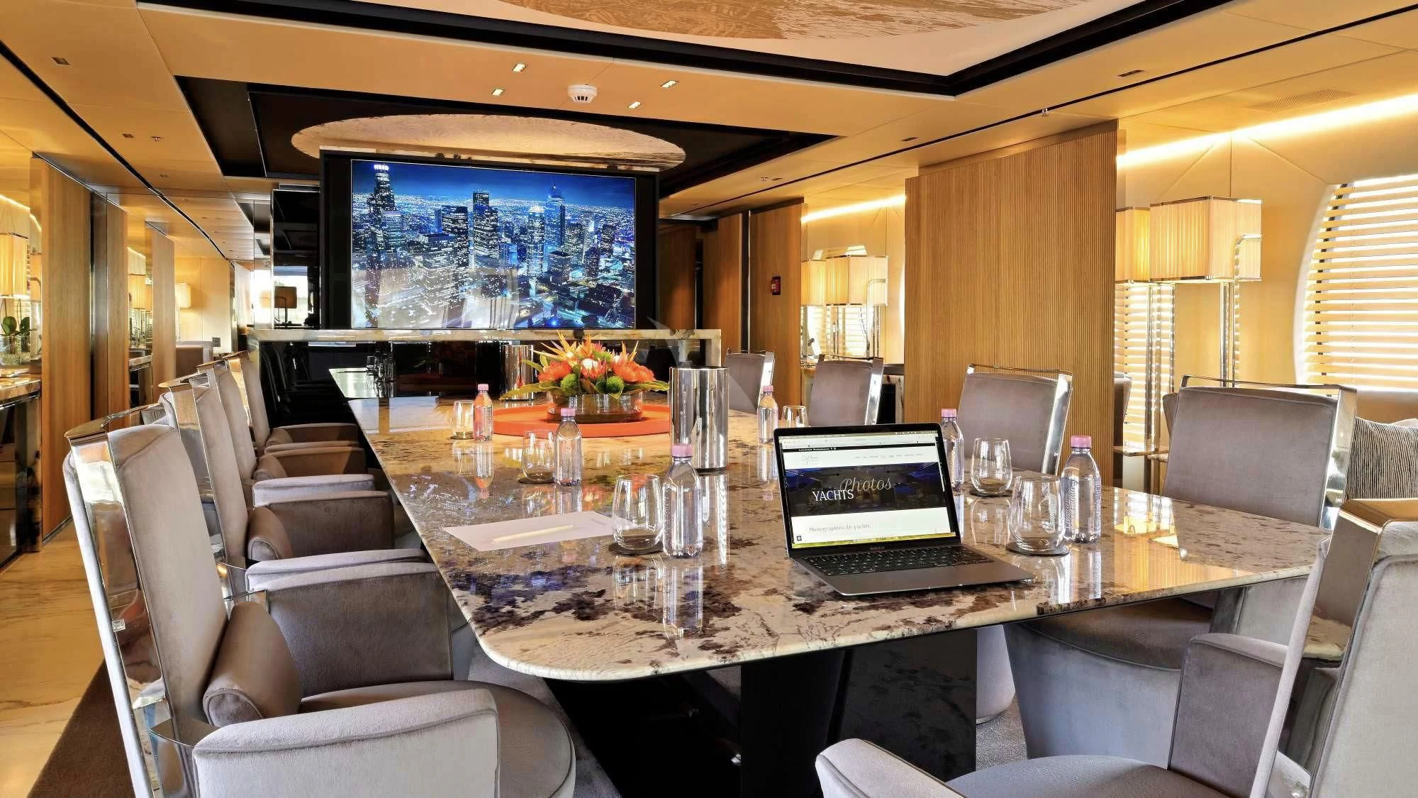 a conference room with a table and chairs aboard SEAHORSE Yacht for Sale