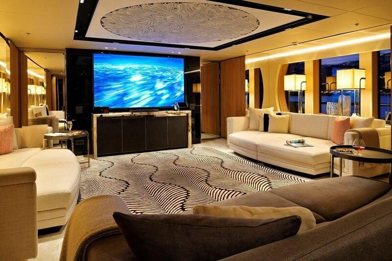 a living room with a large television aboard SEAHORSE Yacht for Sale