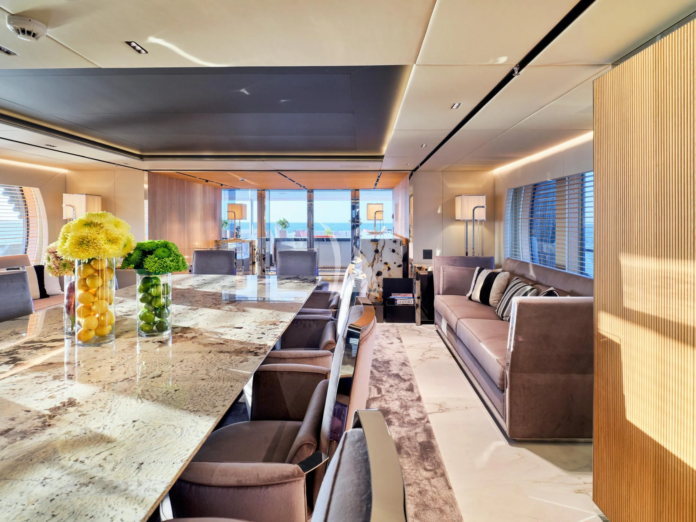 a living room with a table and chairs aboard SEAHORSE Yacht for Sale