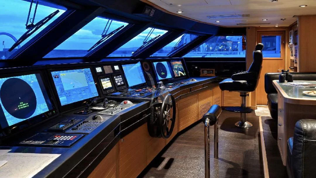 a room with many monitors and a chair aboard SEAHORSE Yacht for Sale