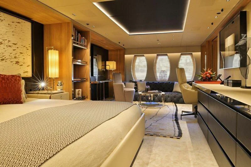 a bedroom with a bed and a couch aboard SEAHORSE Yacht for Sale