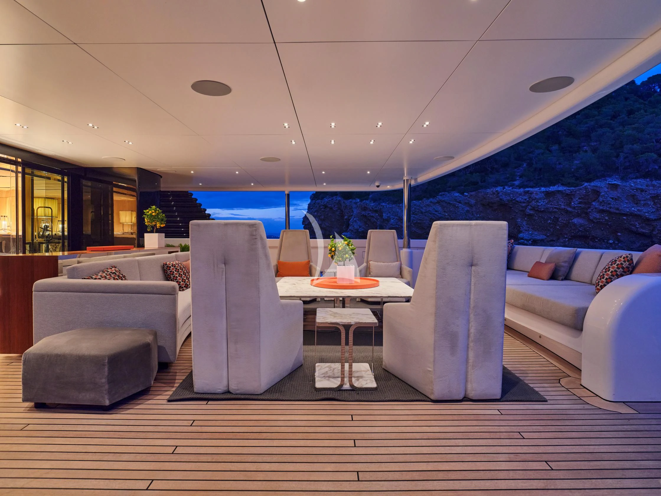 a room with a couch and a table and a large window aboard SEAHORSE Yacht for Sale