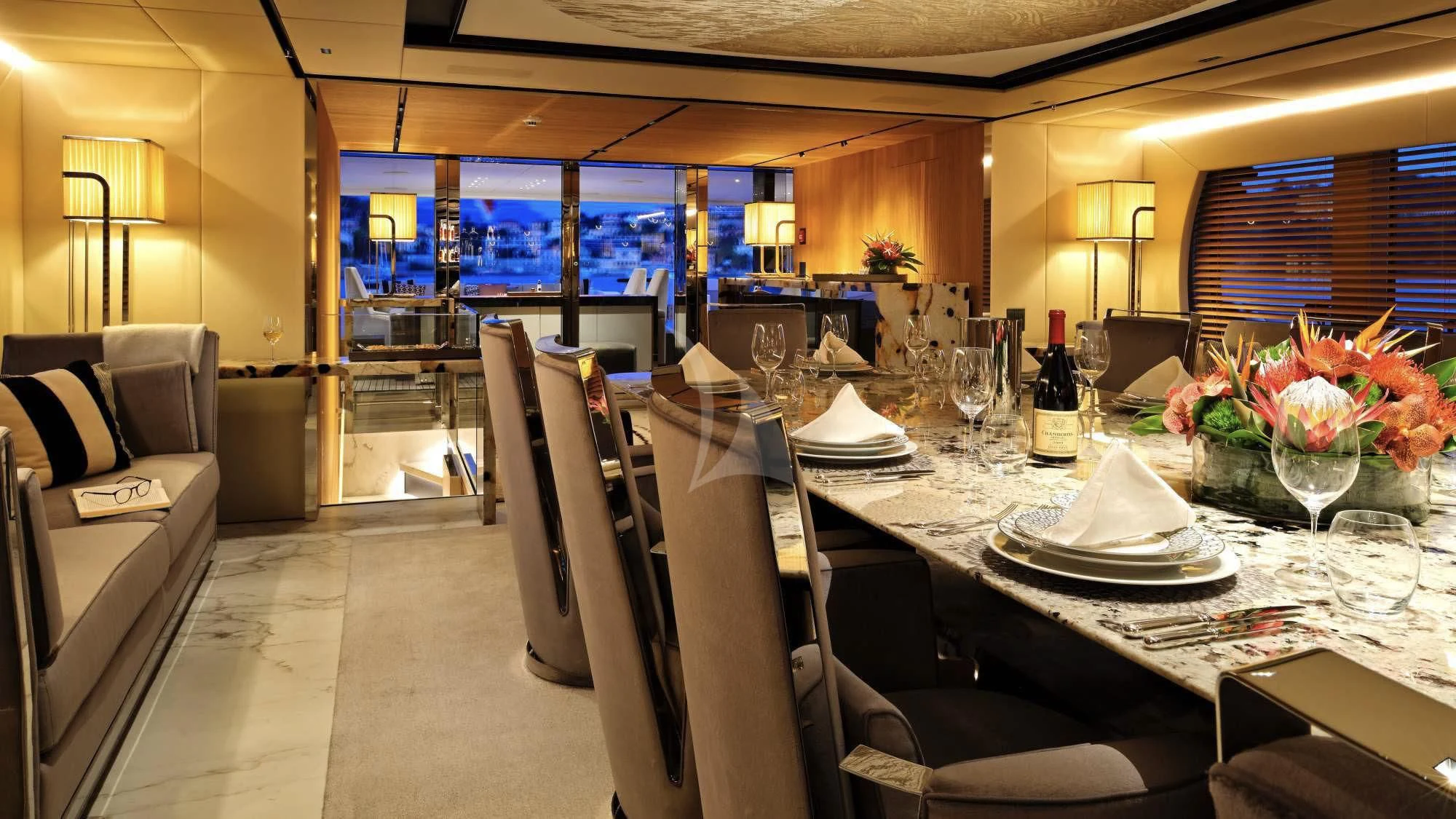 a table with chairs and a glass of wine on it aboard SEAHORSE Yacht for Sale