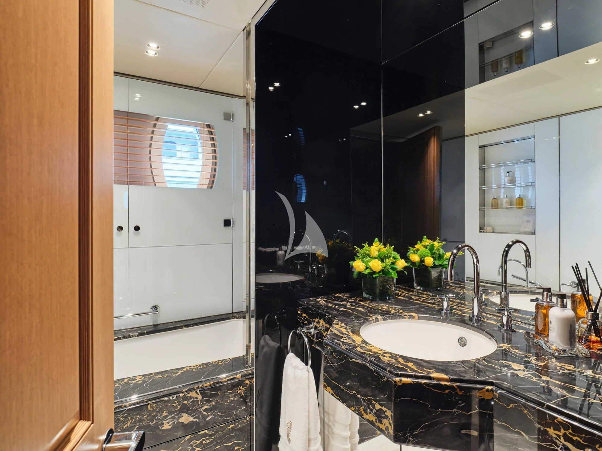 a bathroom with a sink and a mirror aboard SEAHORSE Yacht for Sale