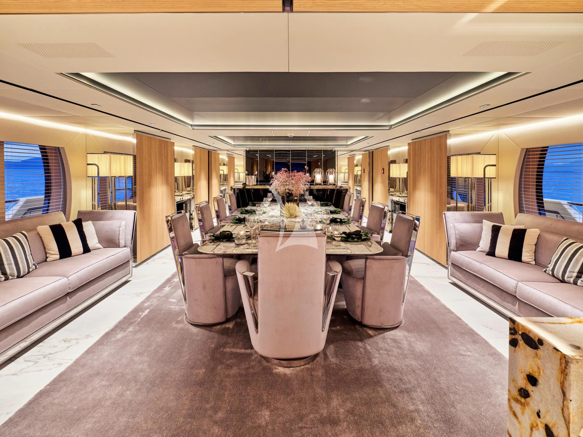 a room with a table chairs and a couch aboard SEAHORSE Yacht for Sale