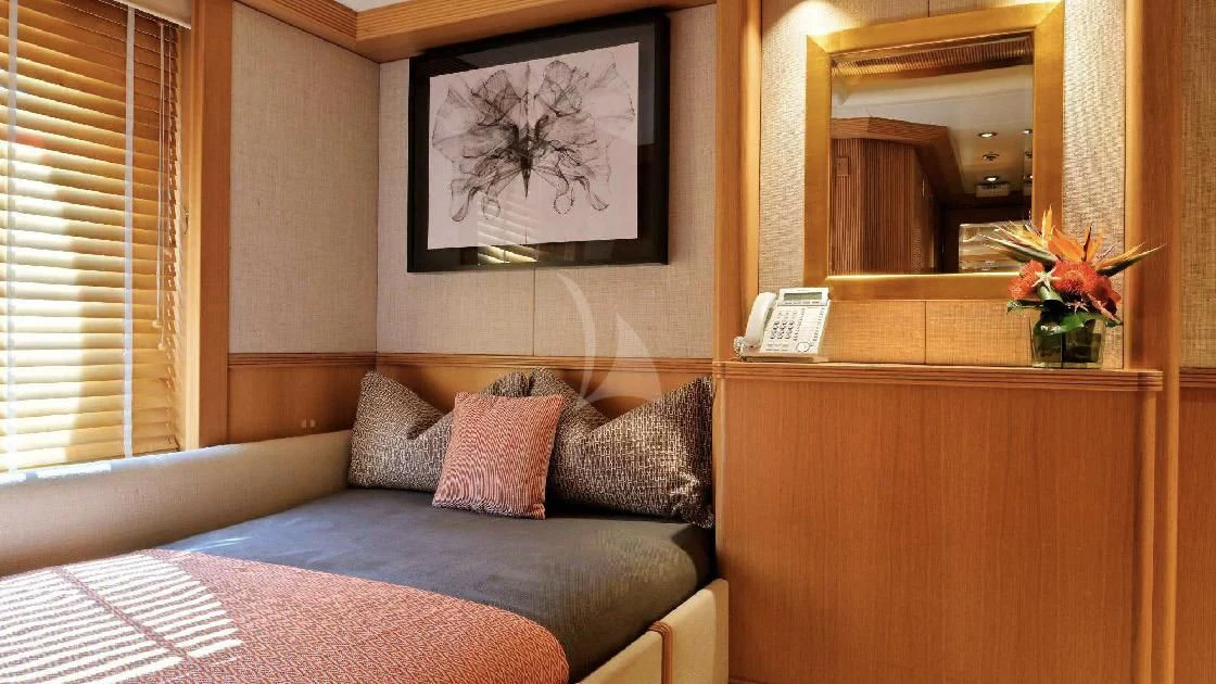 a bed with a blue blanket aboard SEAHORSE Yacht for Sale