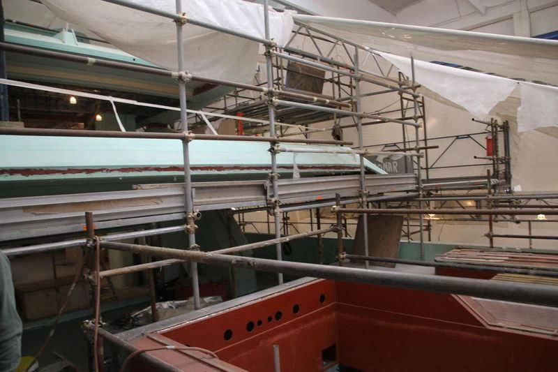 a boat in a large building aboard SEVEN SINS Yacht for Sale