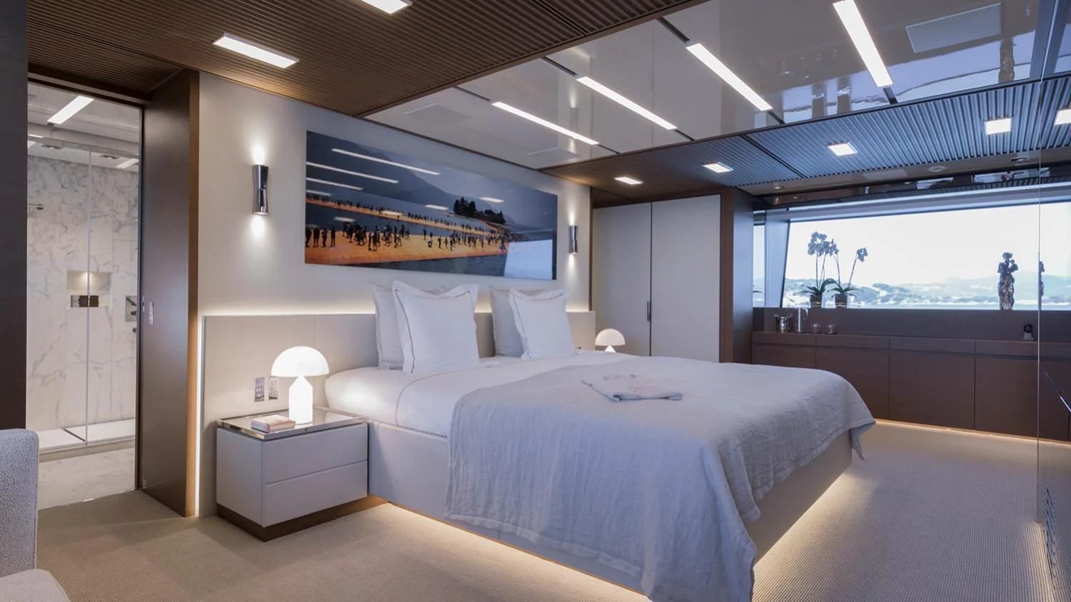 a room with a bed and a desk aboard SEVEN SINS Yacht for Sale