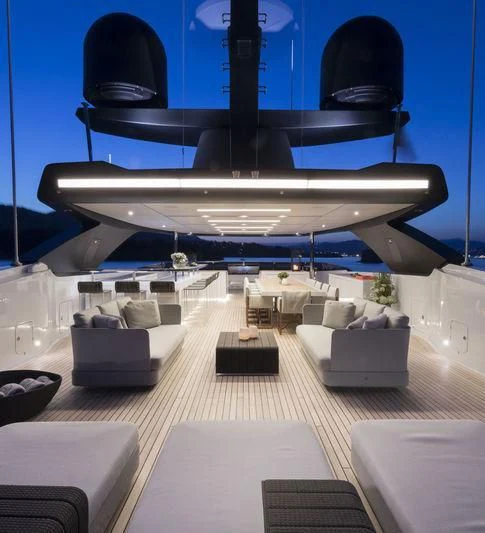 a large room with a large white and blue ceiling and a large white and black object with a aboard SEVEN SINS Yacht for Sale
