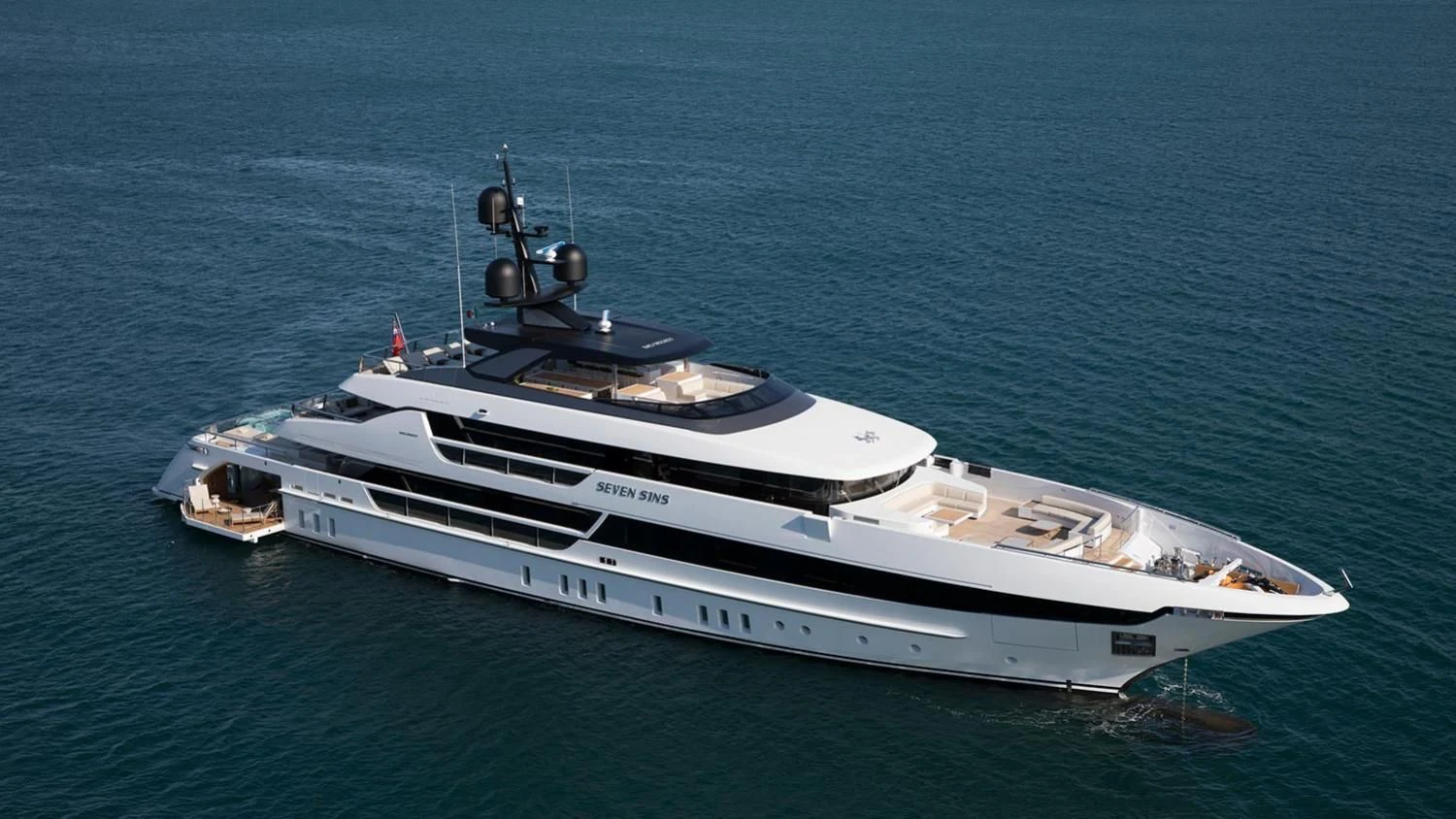 a white yacht in the ocean aboard SEVEN SINS Yacht for Sale