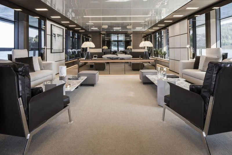 a large room with several couches aboard SEVEN SINS Yacht for Sale