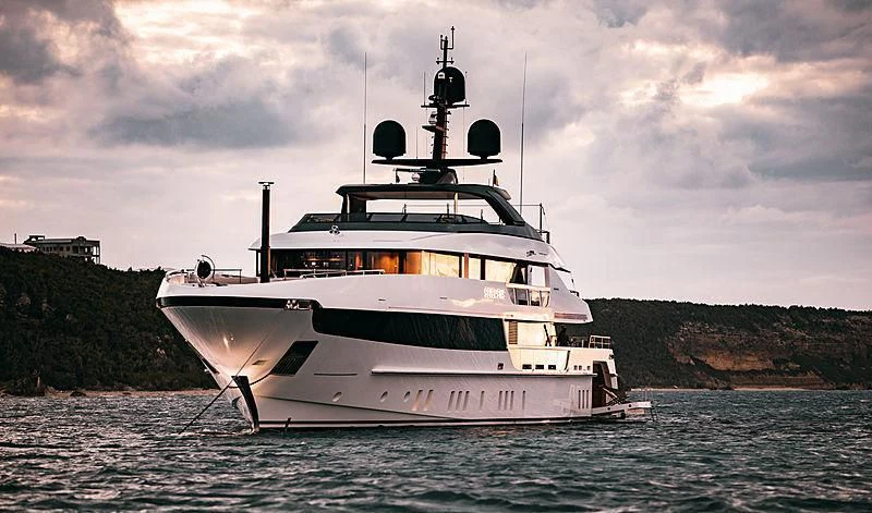 a large white ship in the water aboard SEVEN SINS Yacht for Sale