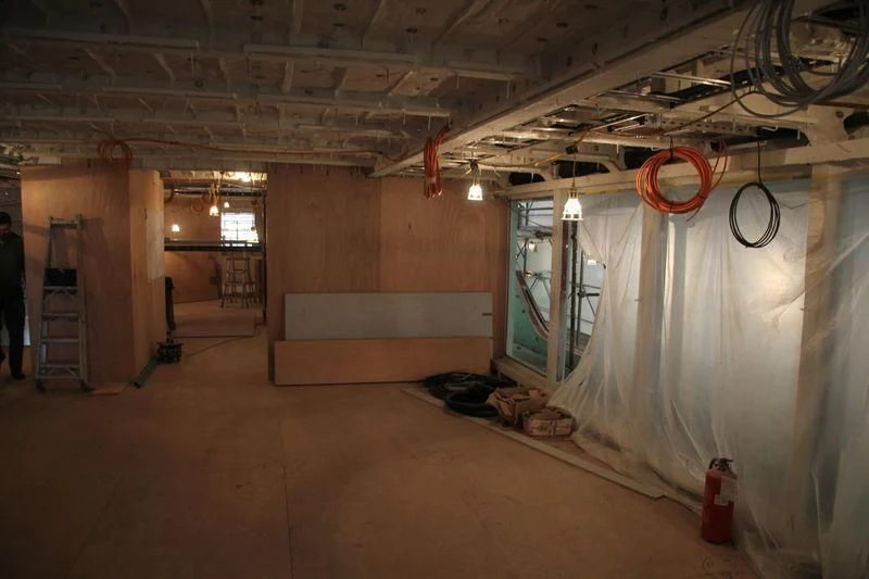a room with a large room with a bike from the ceiling aboard SEVEN SINS Yacht for Sale