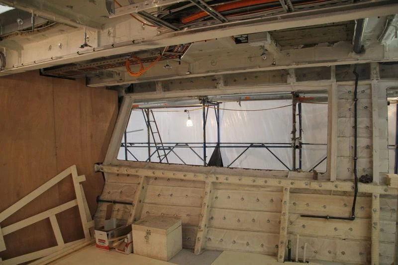 a room with a lot of wood aboard SEVEN SINS Yacht for Sale