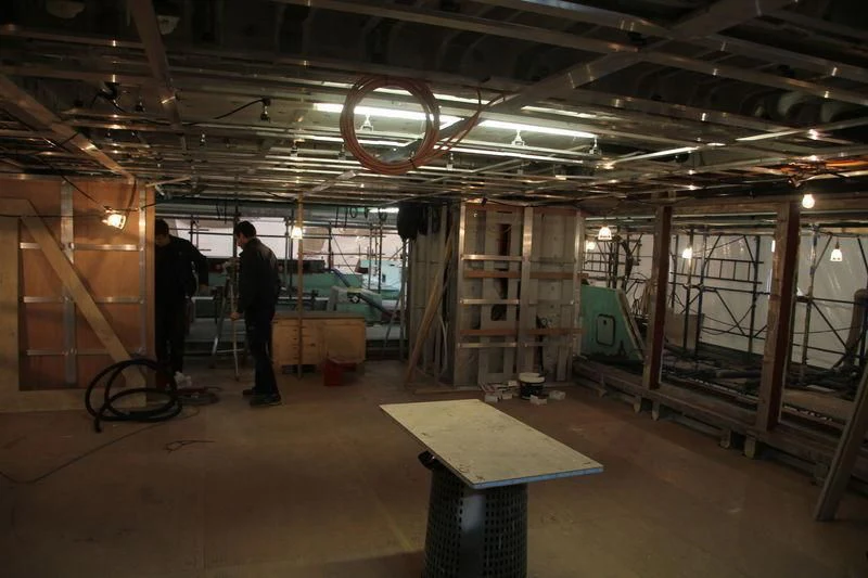 a room with a few men aboard SEVEN SINS Yacht for Sale