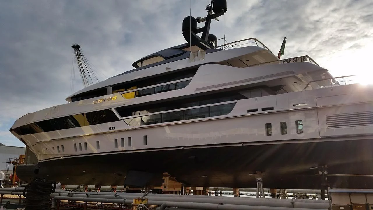 a large cruise ship docked aboard SEVEN SINS Yacht for Sale