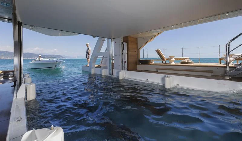 a person standing on a boat aboard SEVEN SINS Yacht for Sale