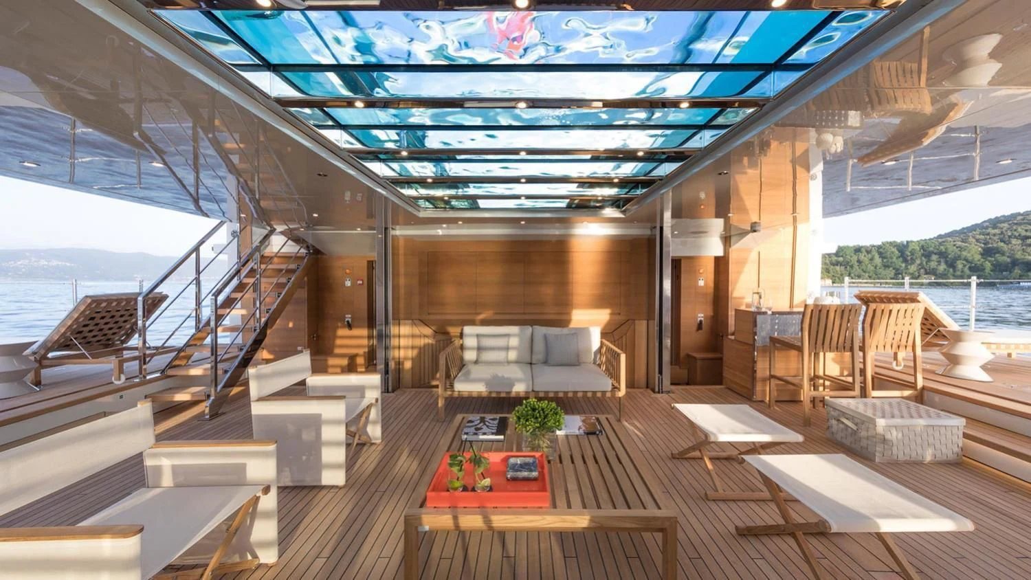 a room with a table and chairs aboard SEVEN SINS Yacht for Sale