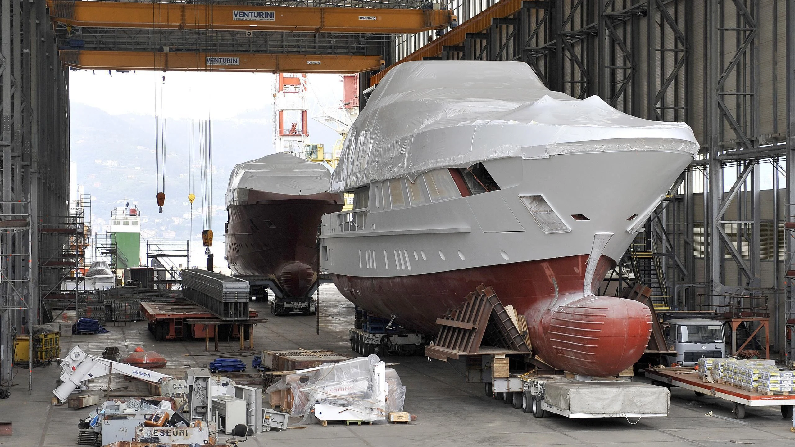 a large space shuttle in a warehouse aboard SEVEN SINS Yacht for Sale