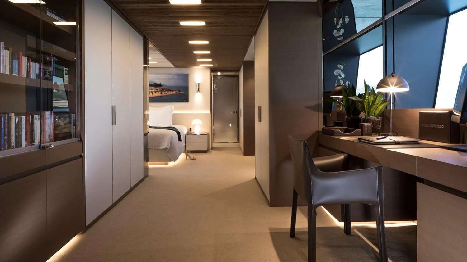 a room with a desk and a bed aboard SEVEN SINS Yacht for Sale