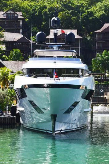 a boat docked at a pier aboard SEVEN SINS Yacht for Sale