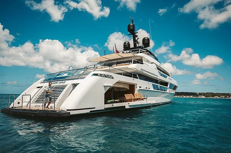 a white boat in the water aboard SEVEN SINS Yacht for Sale