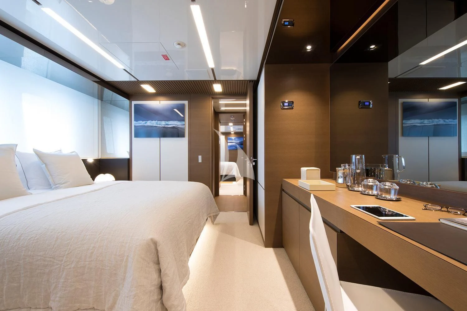 a hotel room with a bed and a desk aboard SEVEN SINS Yacht for Sale