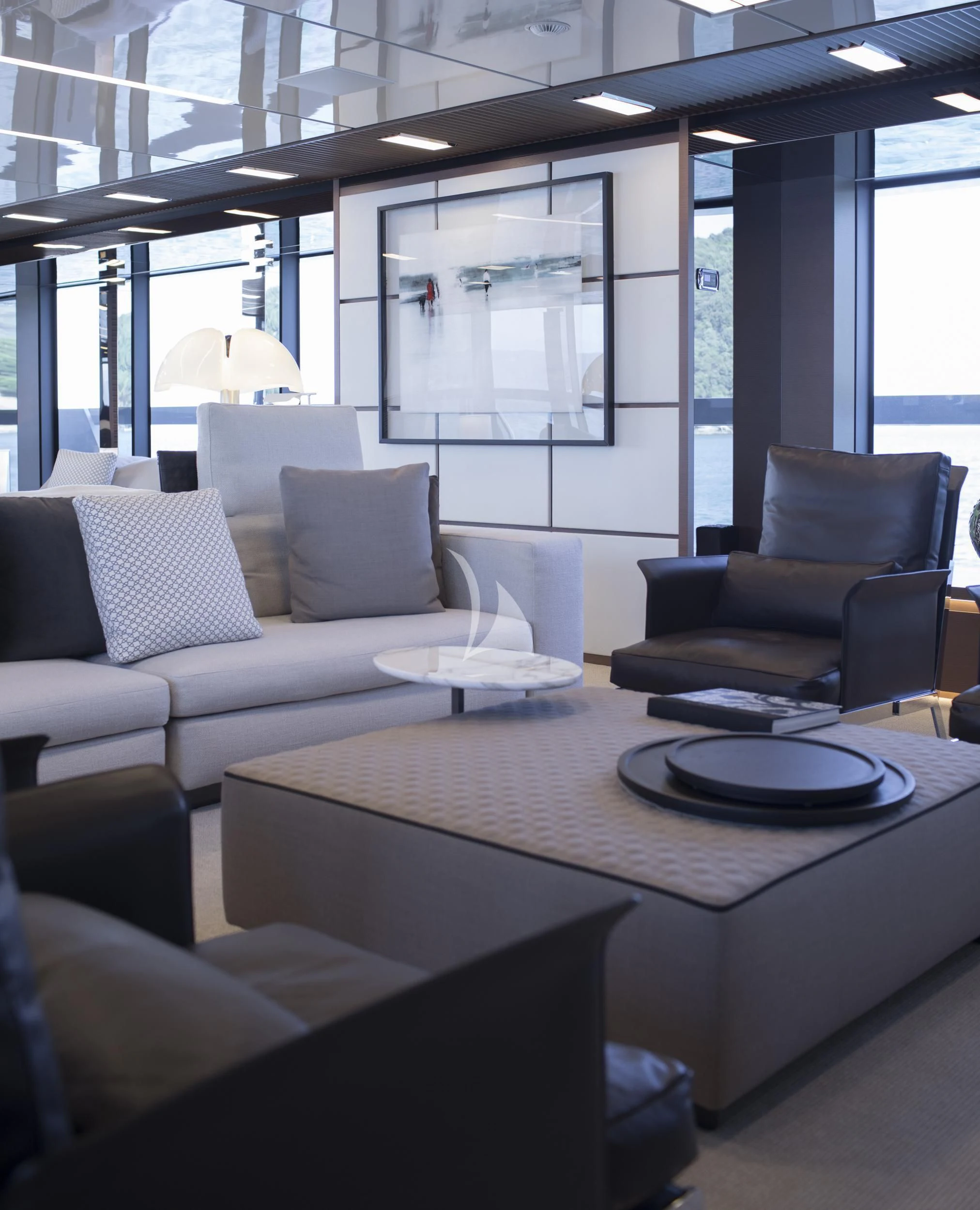 a room with couches and a table aboard SEVEN SINS Yacht for Sale