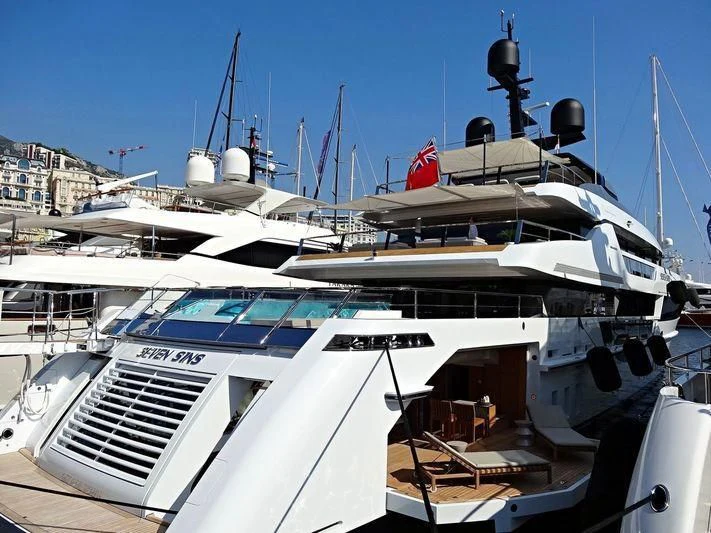 a boat docked at a pier aboard SEVEN SINS Yacht for Sale