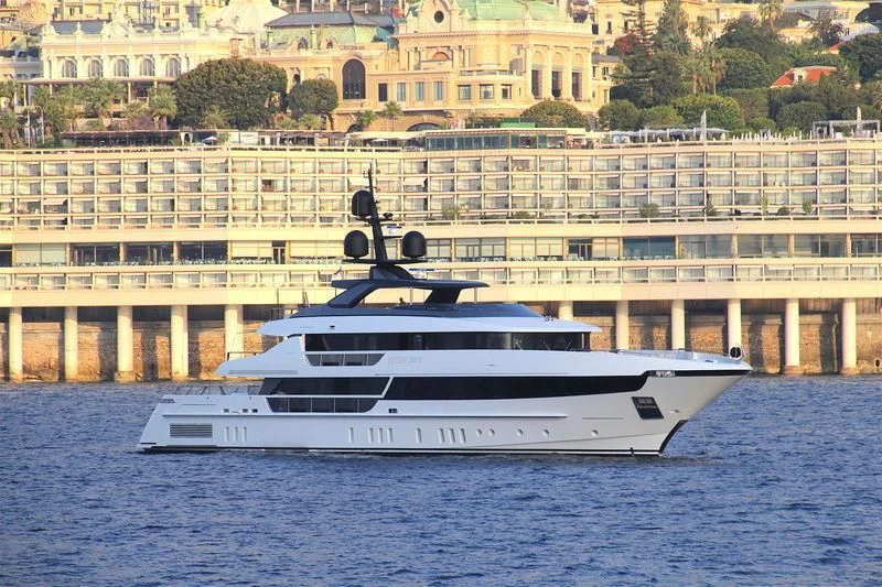 a large white yacht in the water aboard SEVEN SINS Yacht for Sale
