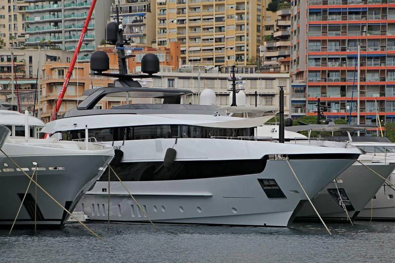 a couple of boats are parked in a harbor aboard SEVEN SINS Yacht for Sale