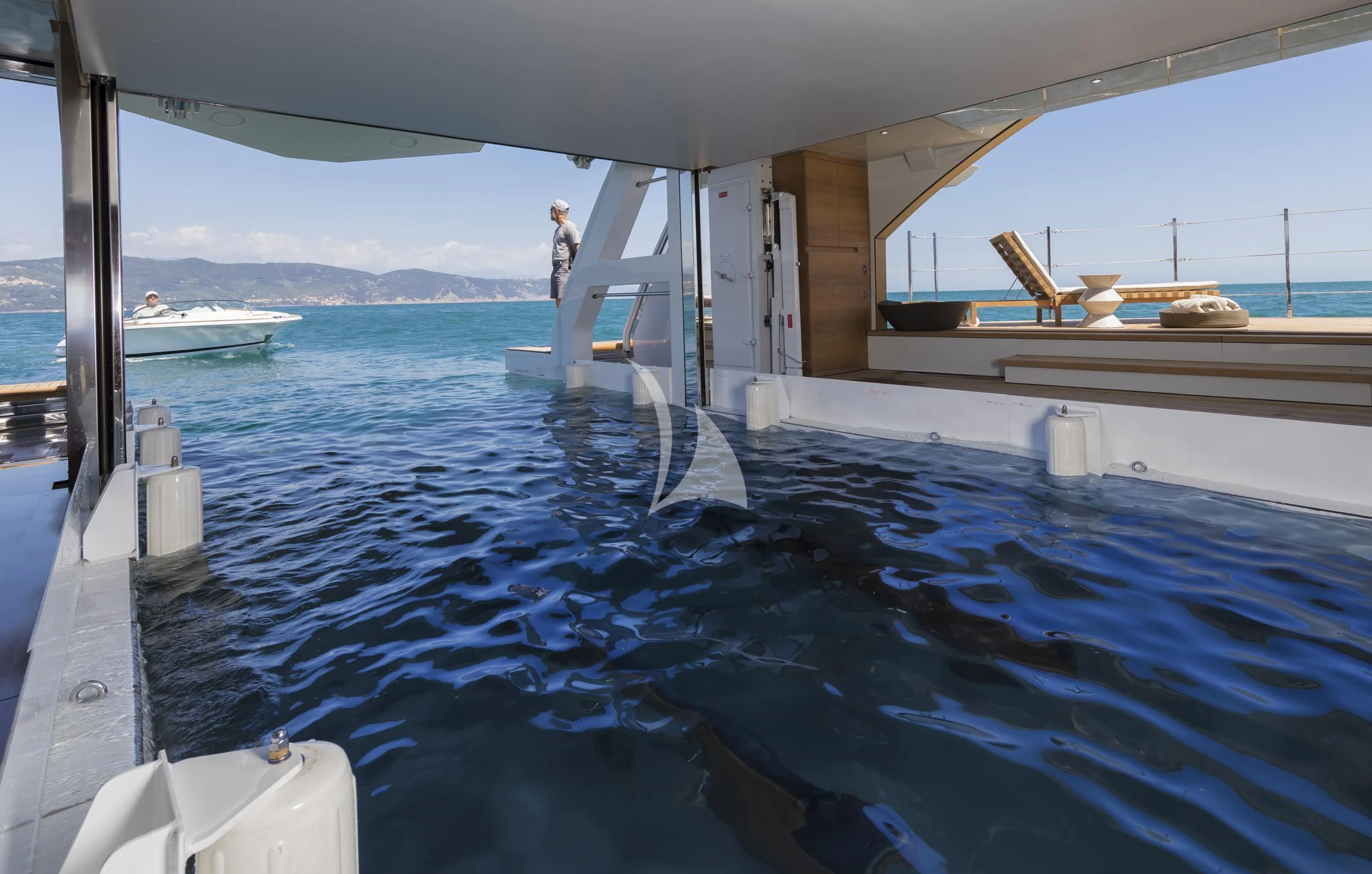 a person standing on a boat aboard SEVEN SINS Yacht for Sale