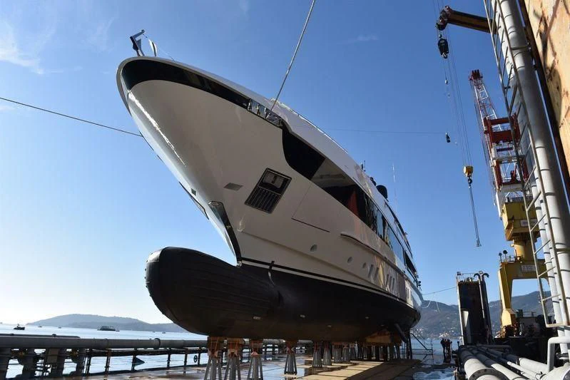 a large white boat on a dock aboard SEVEN SINS Yacht for Sale