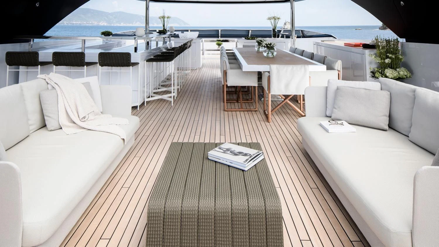 a room with a table chairs and a couch aboard SEVEN SINS Yacht for Sale
