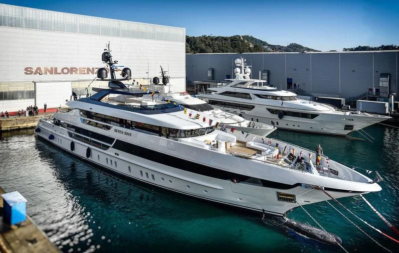 a large boat docked at a pier aboard SEVEN SINS Yacht for Sale