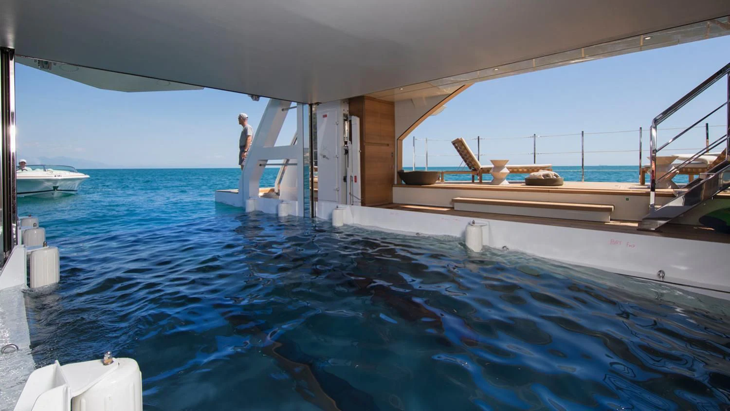 a person standing on a boat aboard SEVEN SINS Yacht for Sale