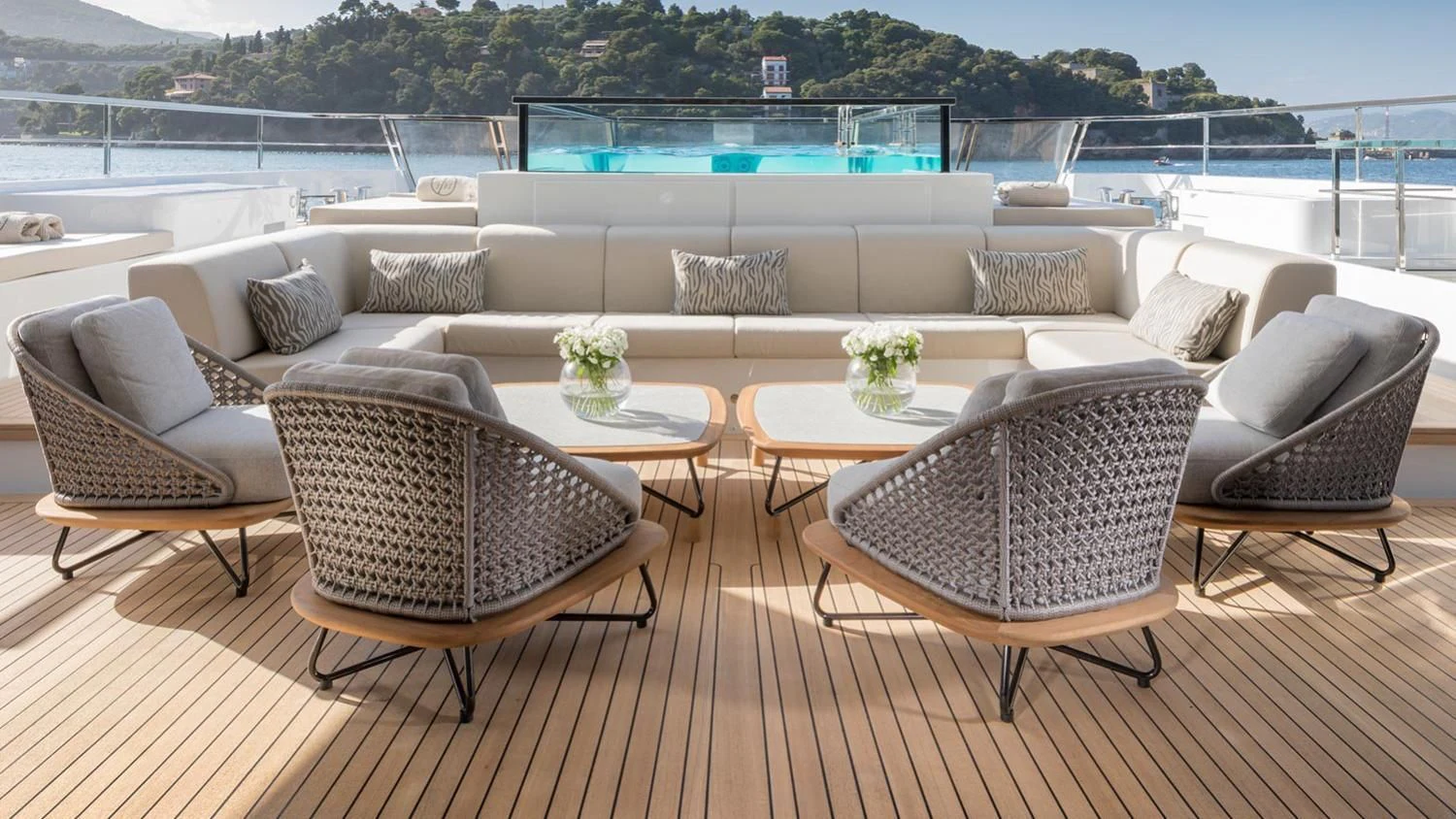 a living room with a couch and a table aboard SEVEN SINS Yacht for Sale