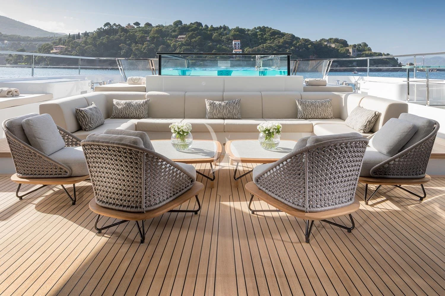 a patio with a table and chairs aboard SEVEN SINS Yacht for Sale