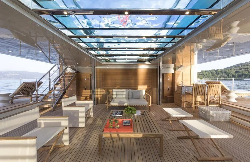 a room with a wood floor and a wood floor with a railing and a railing with a body aboard SEVEN SINS Yacht for Sale