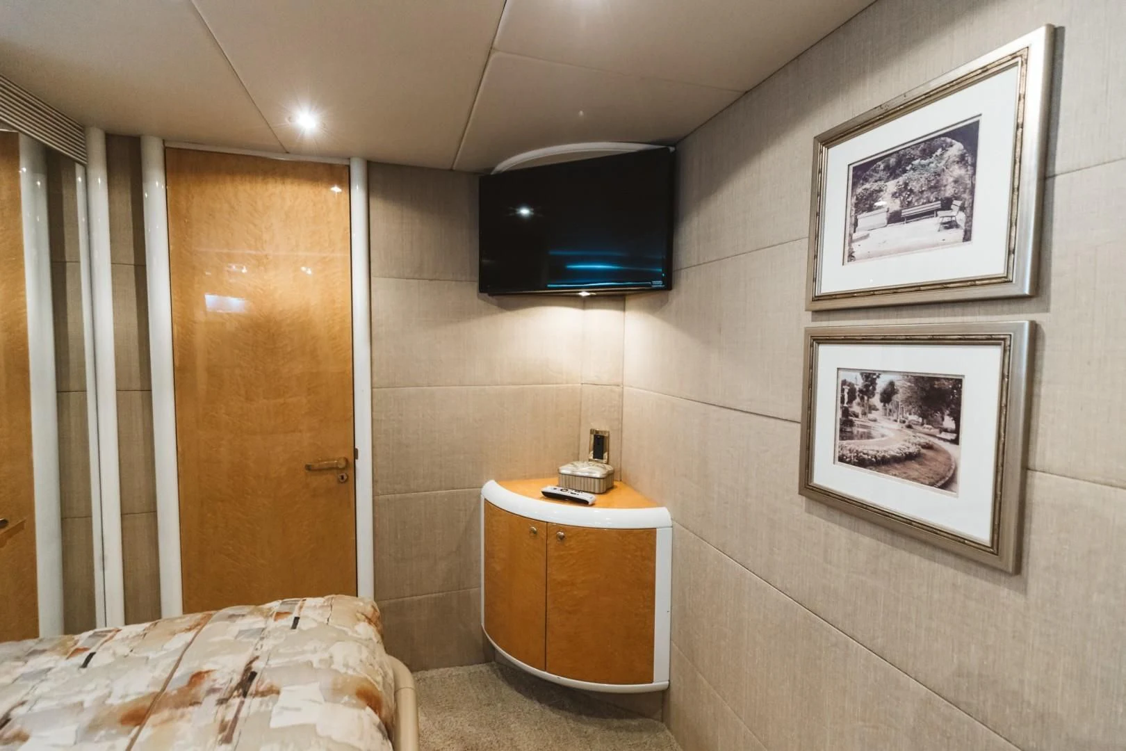 a hotel room with a tv and a bed aboard DOUBLE EAGLE Yacht for Sale
