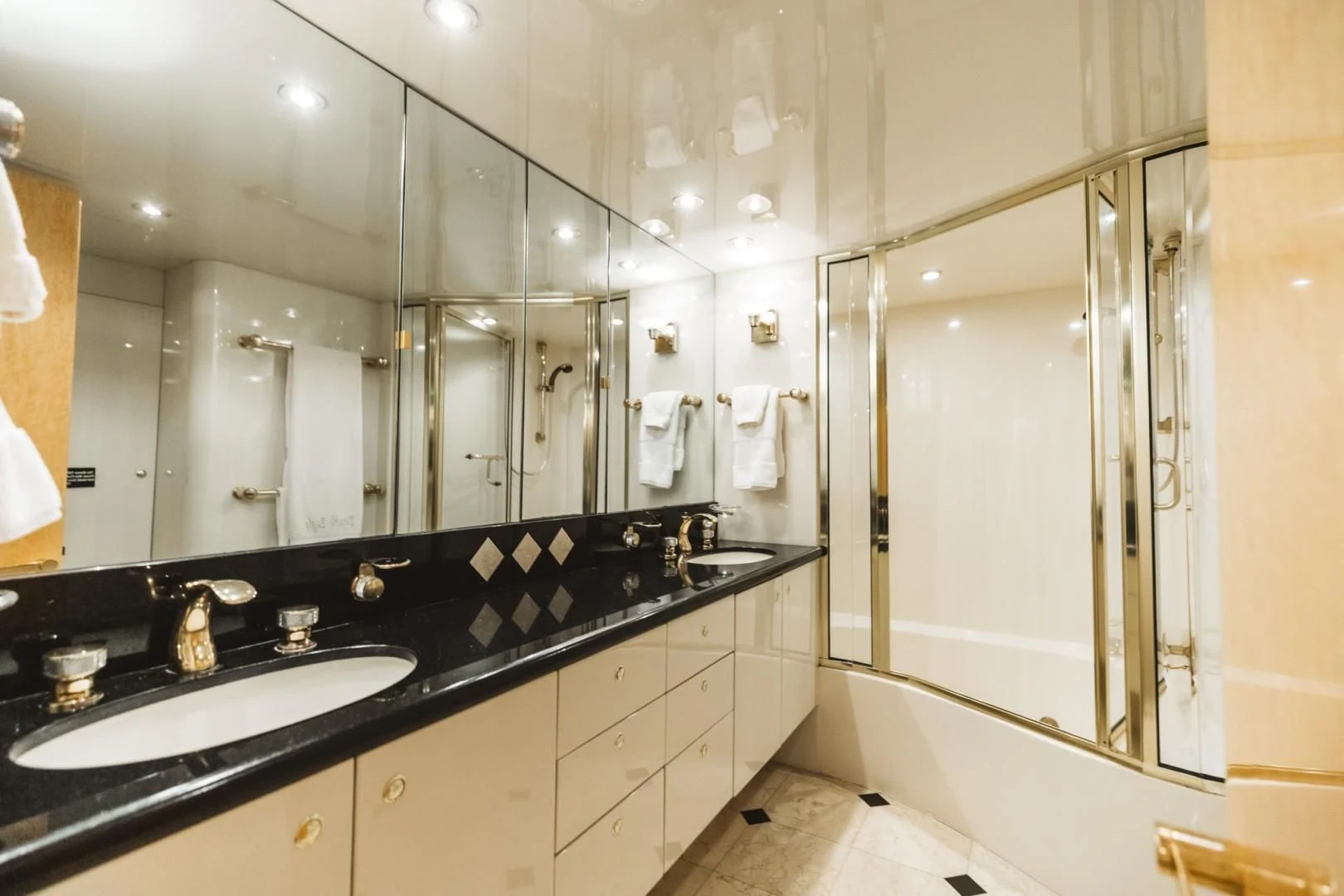 a bathroom with a large mirror aboard DOUBLE EAGLE Yacht for Sale