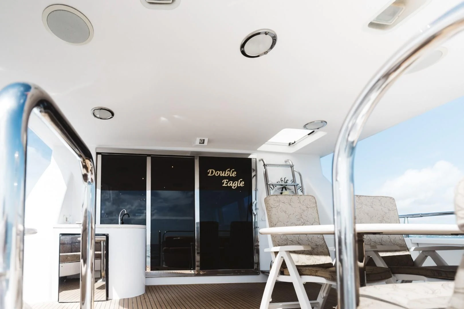 a boat with chairs on the deck aboard DOUBLE EAGLE Yacht for Sale